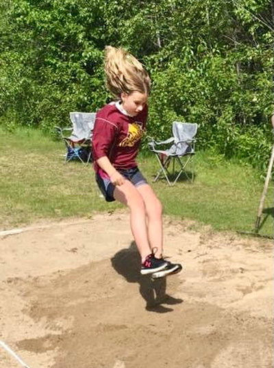 A student mid- long jump
