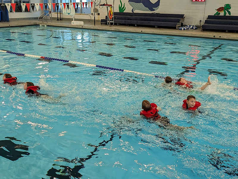Kids swimming in a pool